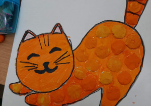 Praca plastyczna wykonana metodą kropki "Kot"